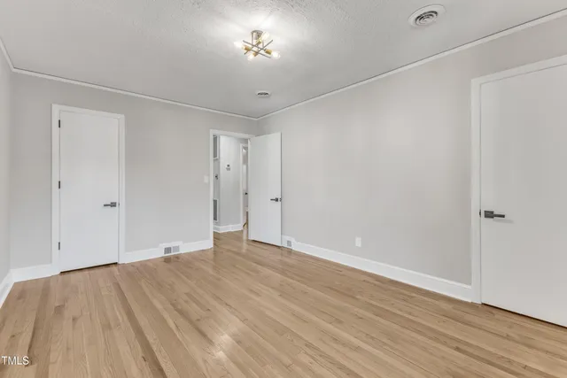 a view of balcony with wooden floor and fence
