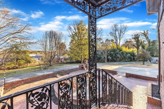 a view of a house with snow on the road