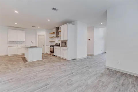 a view of kitchen with wooden floor