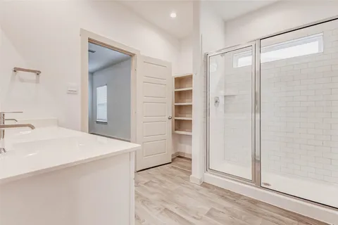 a view of bathroom with a sink and a mirror