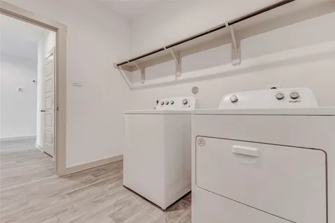 a white refrigerator freezer sitting inside of a kitchen