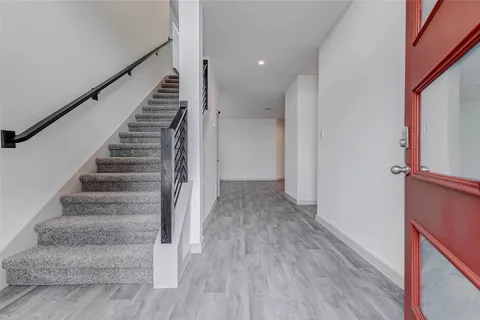 a view of entryway with wooden floor