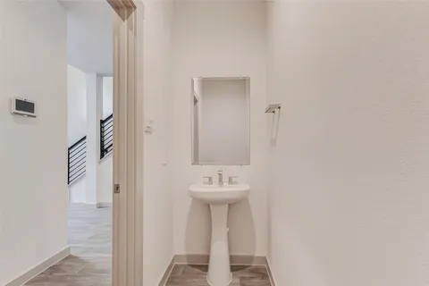 a bathroom with a sink a mirror and a shower