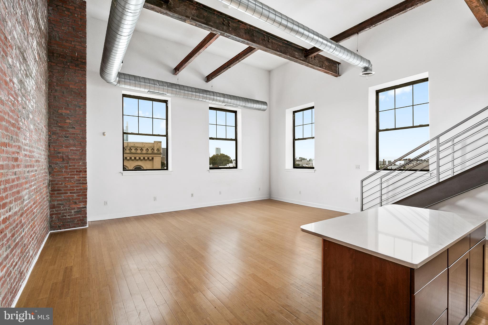 1637-39 Poplar Street, Unit S4 Philadelphia, PA 19130 - Photo 7 of 26 a view of an empty room with window and wooden floor