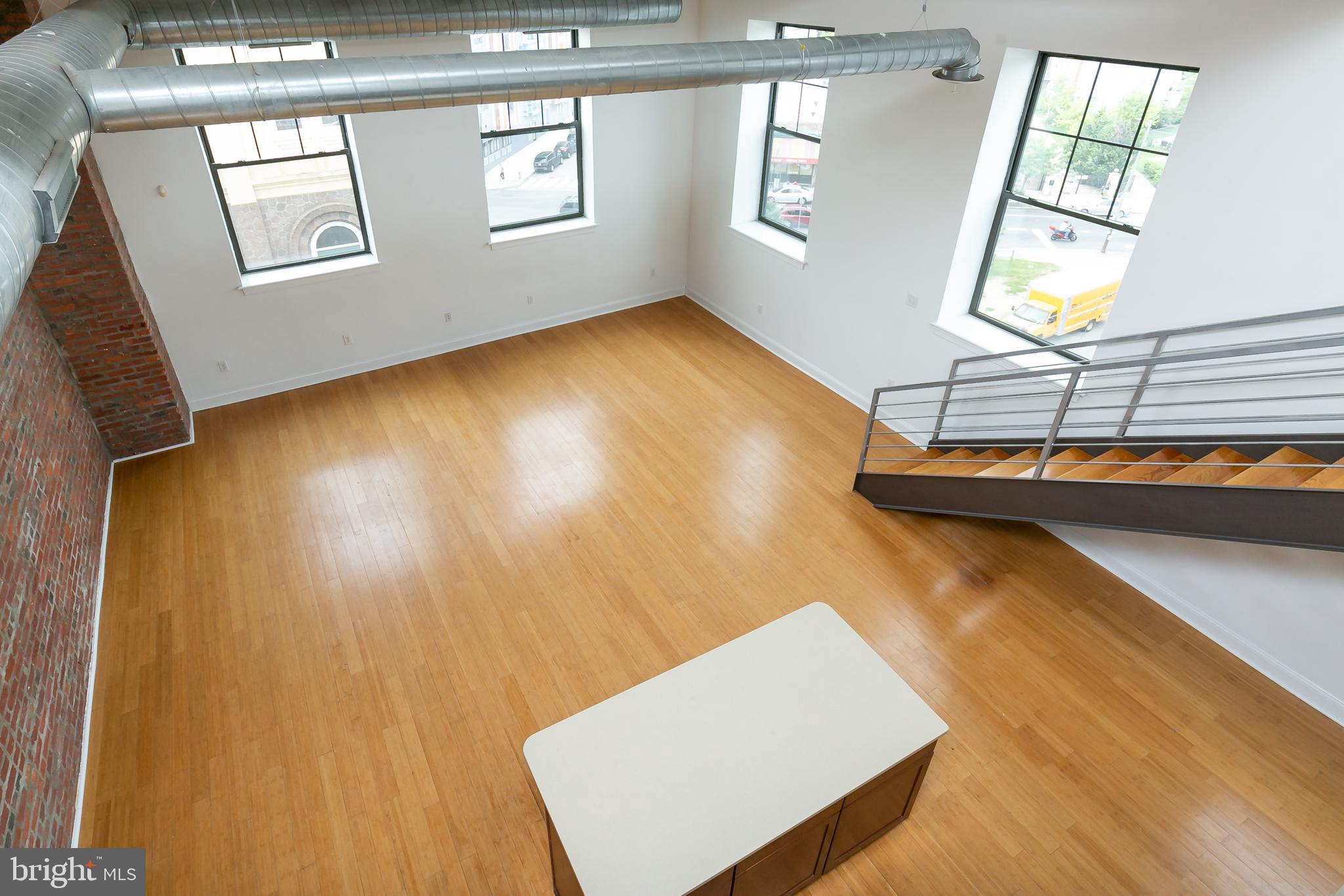 1637-39 Poplar Street, Unit S4 Philadelphia, PA 19130 - Photo 10 of 26 a view of an empty room with window and wooden floor