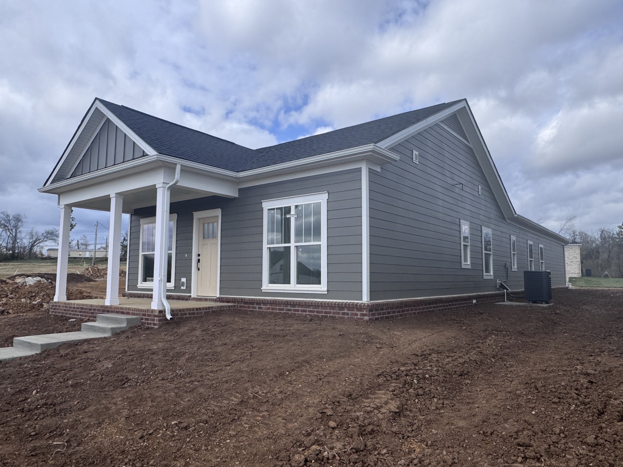 1823 Flatwaters St Spring Hill Spring Hill, TN 37174 - Photo 2 of 5 a front view of a house with a garden