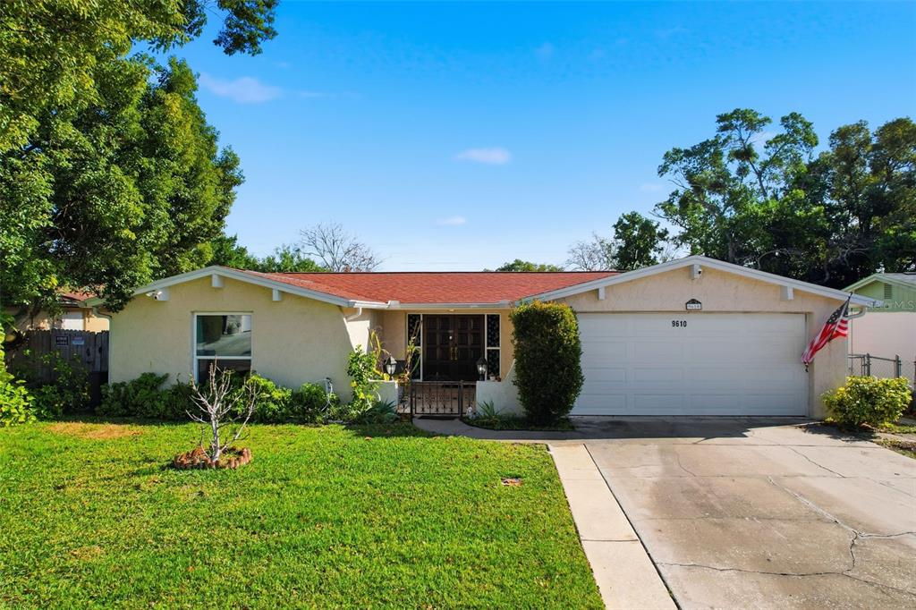9610 Rainbow Lane Port Richey, FL 34668 - Photo 1 of 34 a view of a house with garden