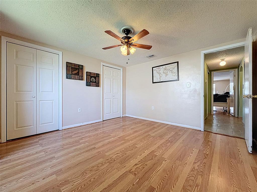 9610 Rainbow Lane Port Richey, FL 34668 - Photo 20 of 34 a view of empty room with wooden floor
