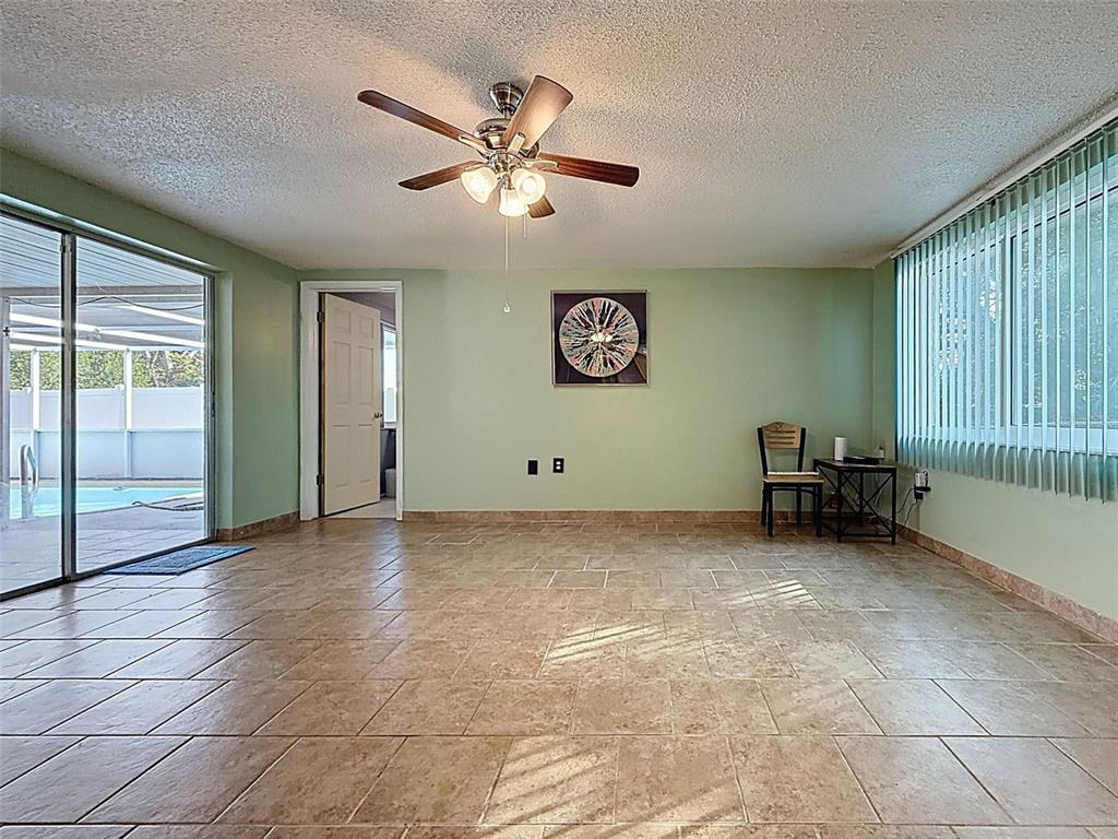 9610 Rainbow Lane Port Richey, FL 34668 - Photo 23 of 34 a view of a livingroom with furniture and an entryway