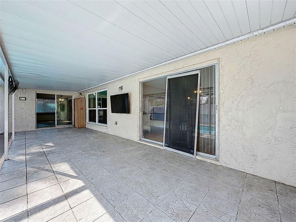 9610 Rainbow Lane Port Richey, FL 34668 - Photo 33 of 34 a view of an empty room with a window