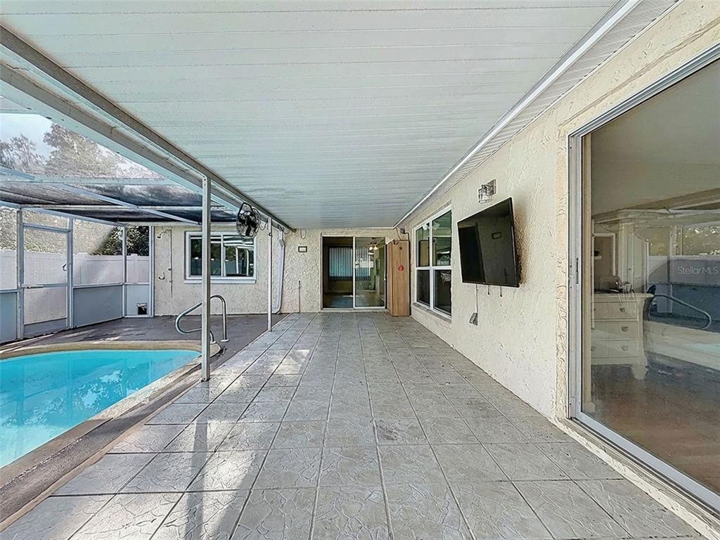 9610 Rainbow Lane Port Richey, FL 34668 - Photo 34 of 34 a view of a house with backyard and a garden