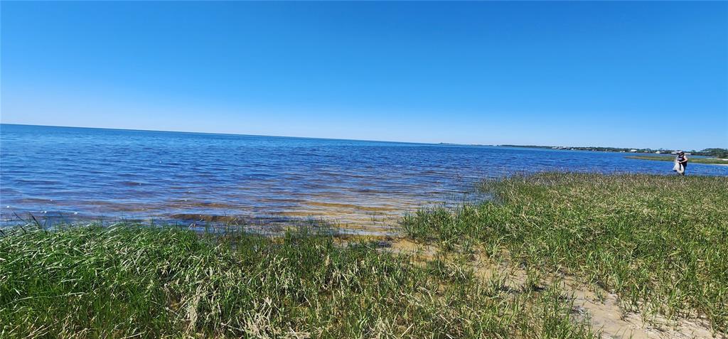 2228 Turkey Oak Road Perry, FL 32348 - Photo 9 of 76 a view of a large body of water with a house in the background