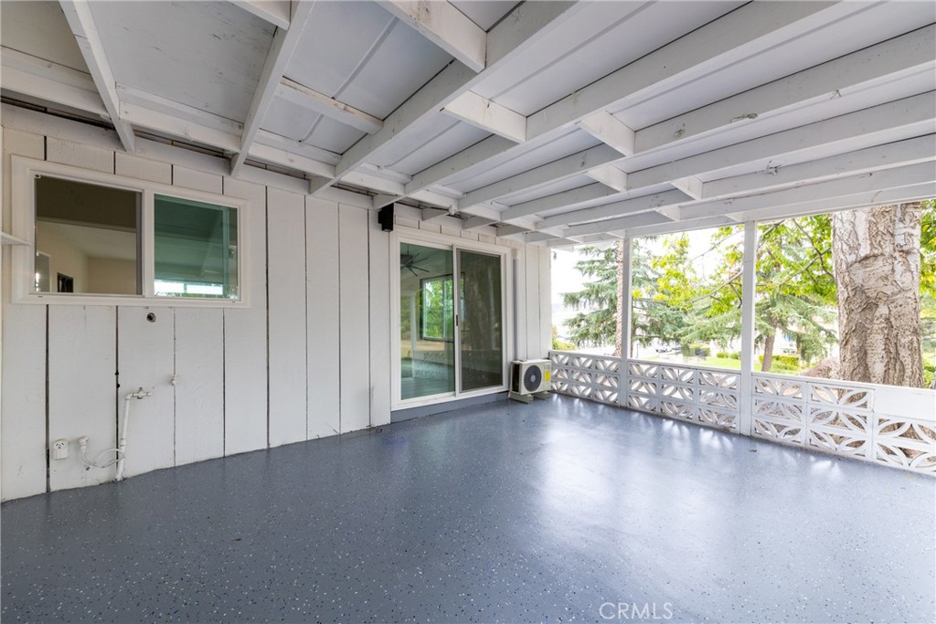 12449 6th Street Yucaipa, CA 92399 - Photo 20 of 37 a view of empty room with wooden floor and fan