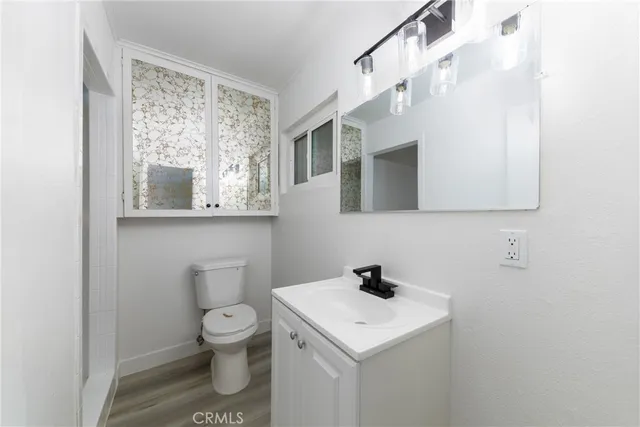a bathroom with a shower and a sink