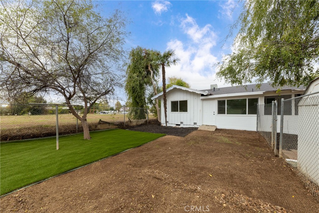 12449 6th Street Yucaipa, CA 92399 - Photo 8 of 37 a front view of a house with garden