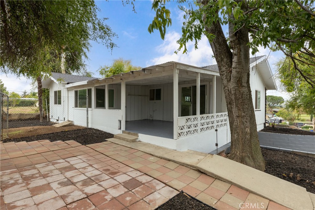 12449 6th Street Yucaipa, CA 92399 - Photo 9 of 37 a front view of a house with a yard and garage