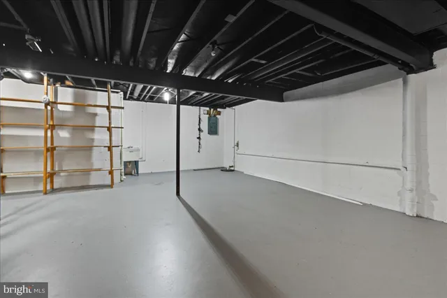 a view of empty room with wooden ceiling