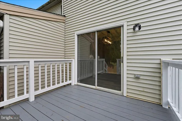 a view of a porch with wooden floor