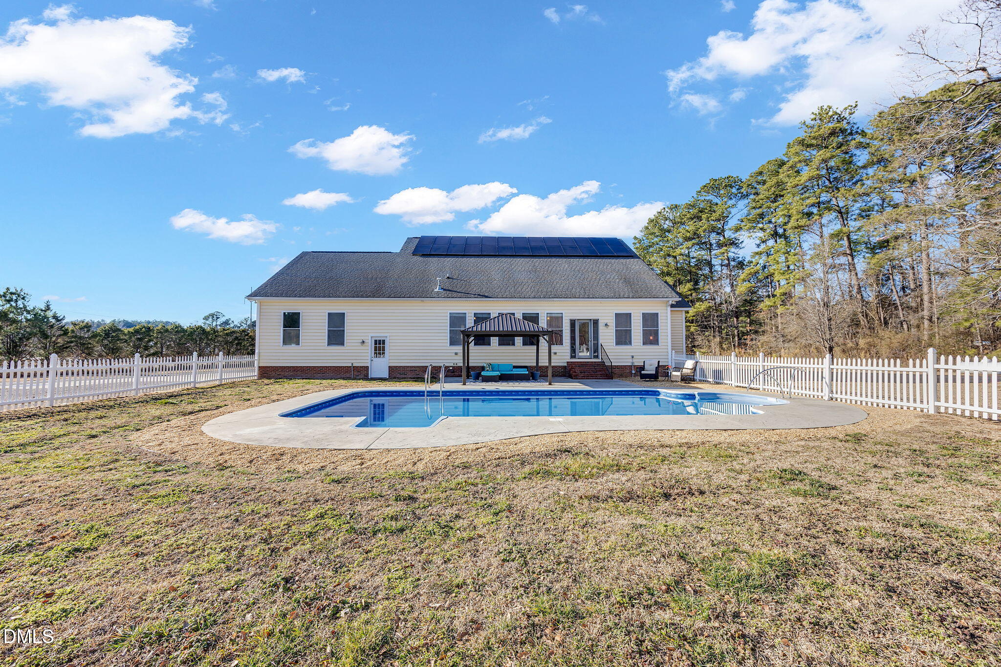 1869 Firetower Road Selma, NC 27576 - Photo 9 of 67 a front view of house with yard and swimming pool