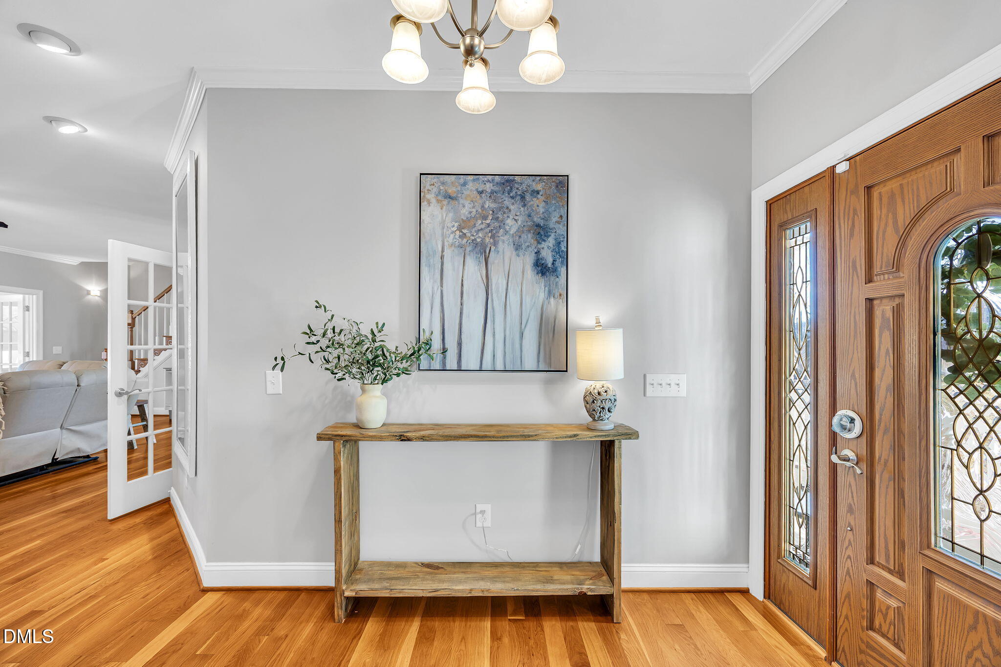 1869 Firetower Road Selma, NC 27576 - Photo 16 of 67 a view of a hallway with wooden floor and cabinet