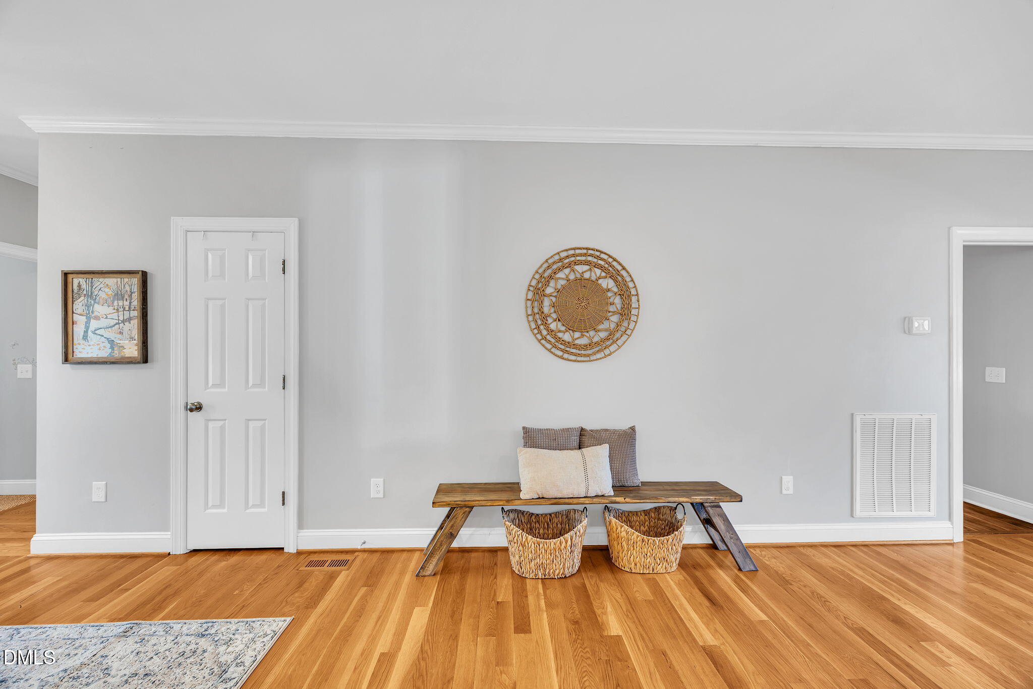 1869 Firetower Road Selma, NC 27576 - Photo 17 of 67 a view of a room with wooden floor and bench
