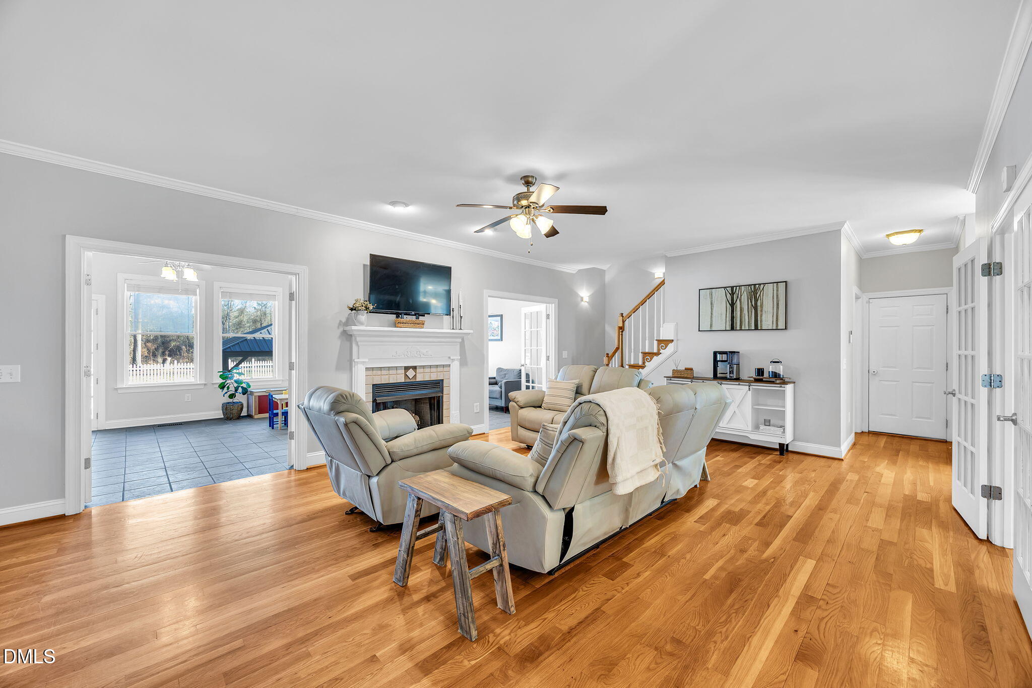 1869 Firetower Road Selma, NC 27576 - Photo 19 of 67 a living room with furniture and a fireplace
