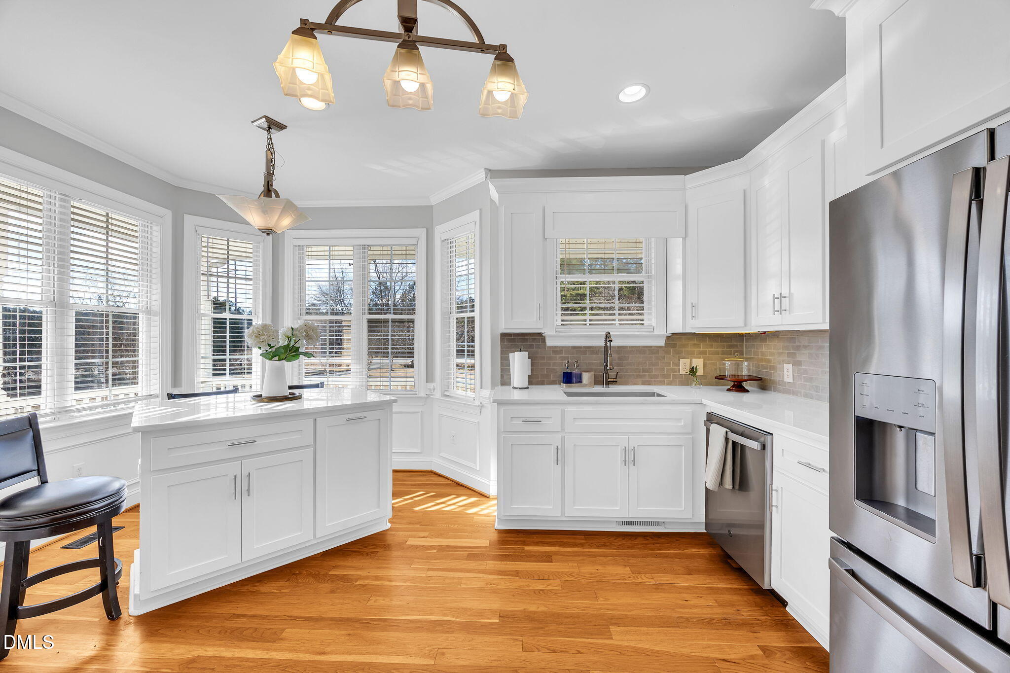 1869 Firetower Road Selma, NC 27576 - Photo 25 of 67 a large kitchen with cabinets wooden floor and stainless steel appliances