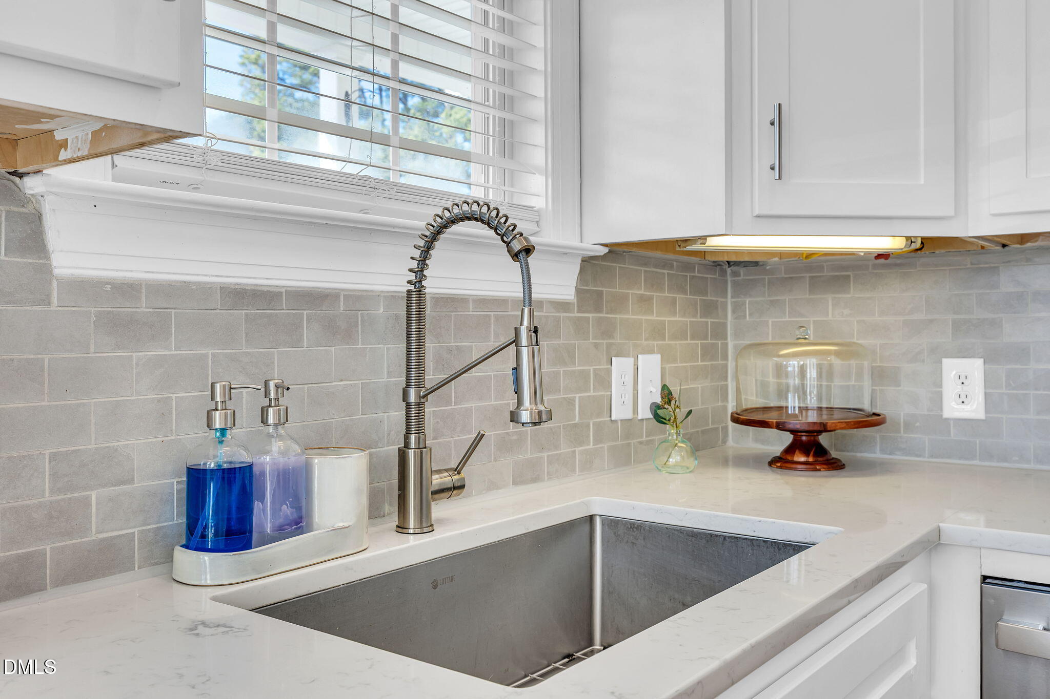 1869 Firetower Road Selma, NC 27576 - Photo 26 of 67 a kitchen with a sink and a window