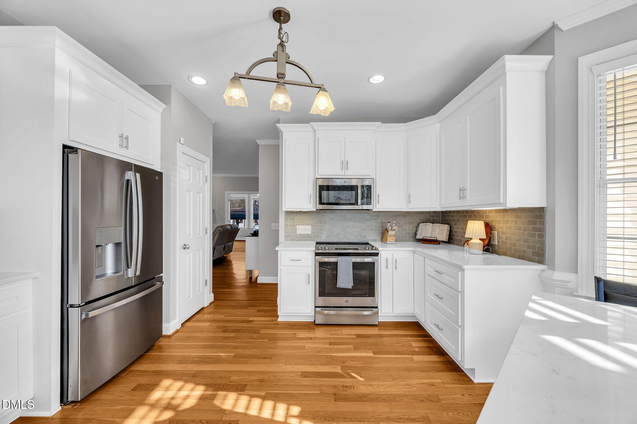 1869 Firetower Road Selma, NC 27576 - Photo 28 of 67 a large kitchen with cabinets and stainless steel appliances