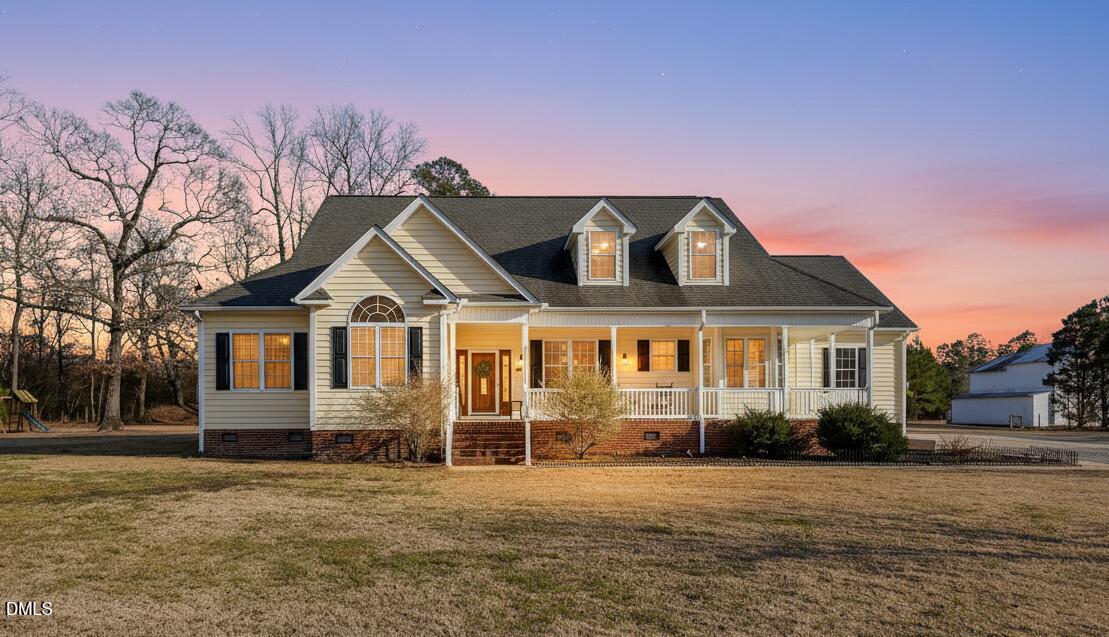 1869 Firetower Road Selma, NC 27576 - Photo 2 of 67 a front view of a house with a yard and garage