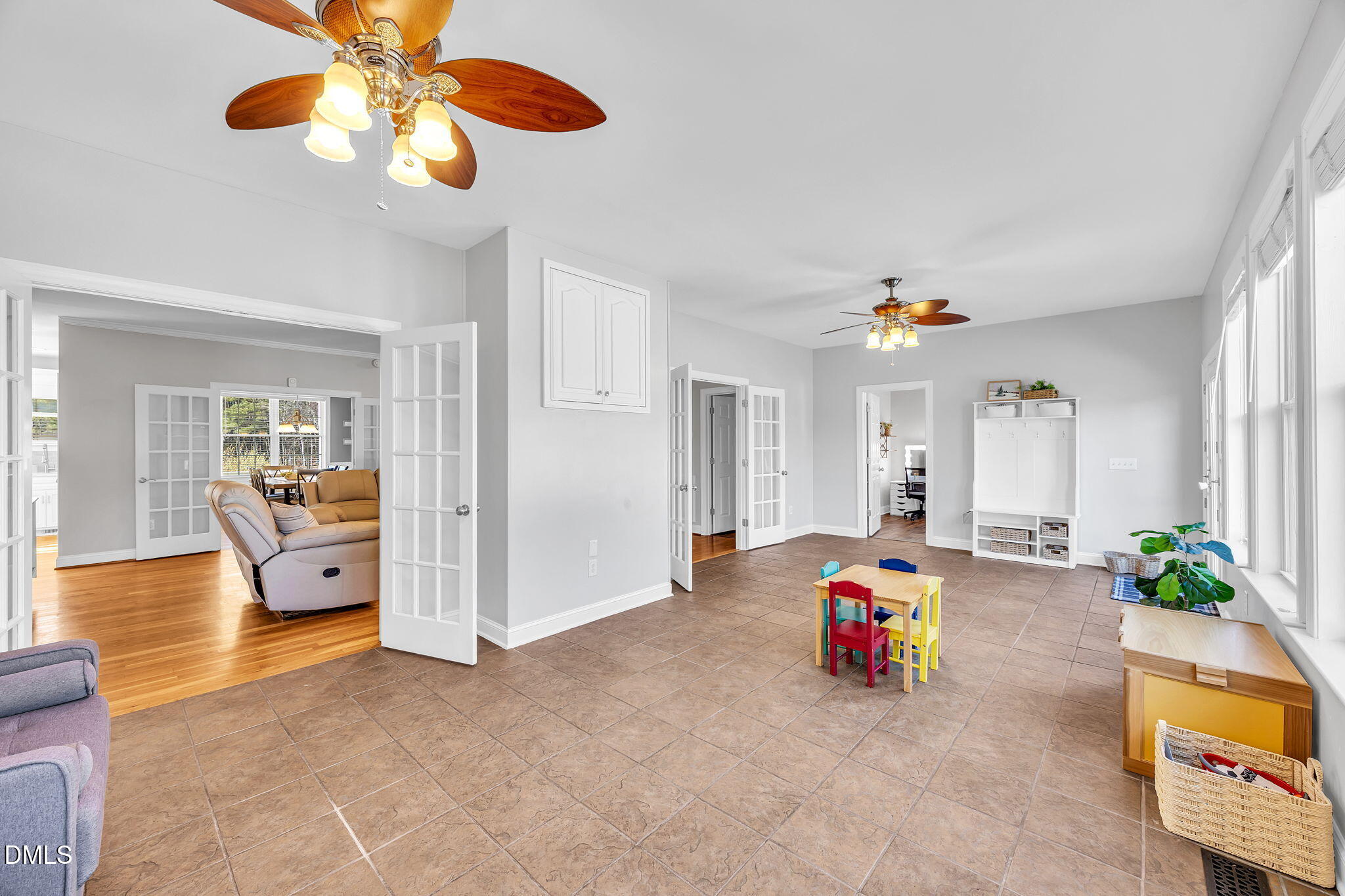 1869 Firetower Road Selma, NC 27576 - Photo 33 of 67 a living room with furniture and a chandelier