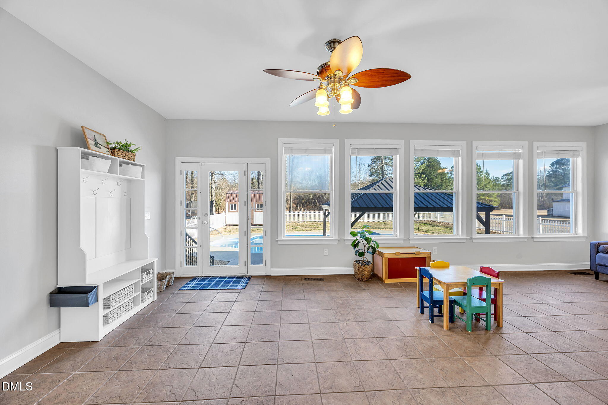 1869 Firetower Road Selma, NC 27576 - Photo 34 of 67 a living room with furniture and large windows