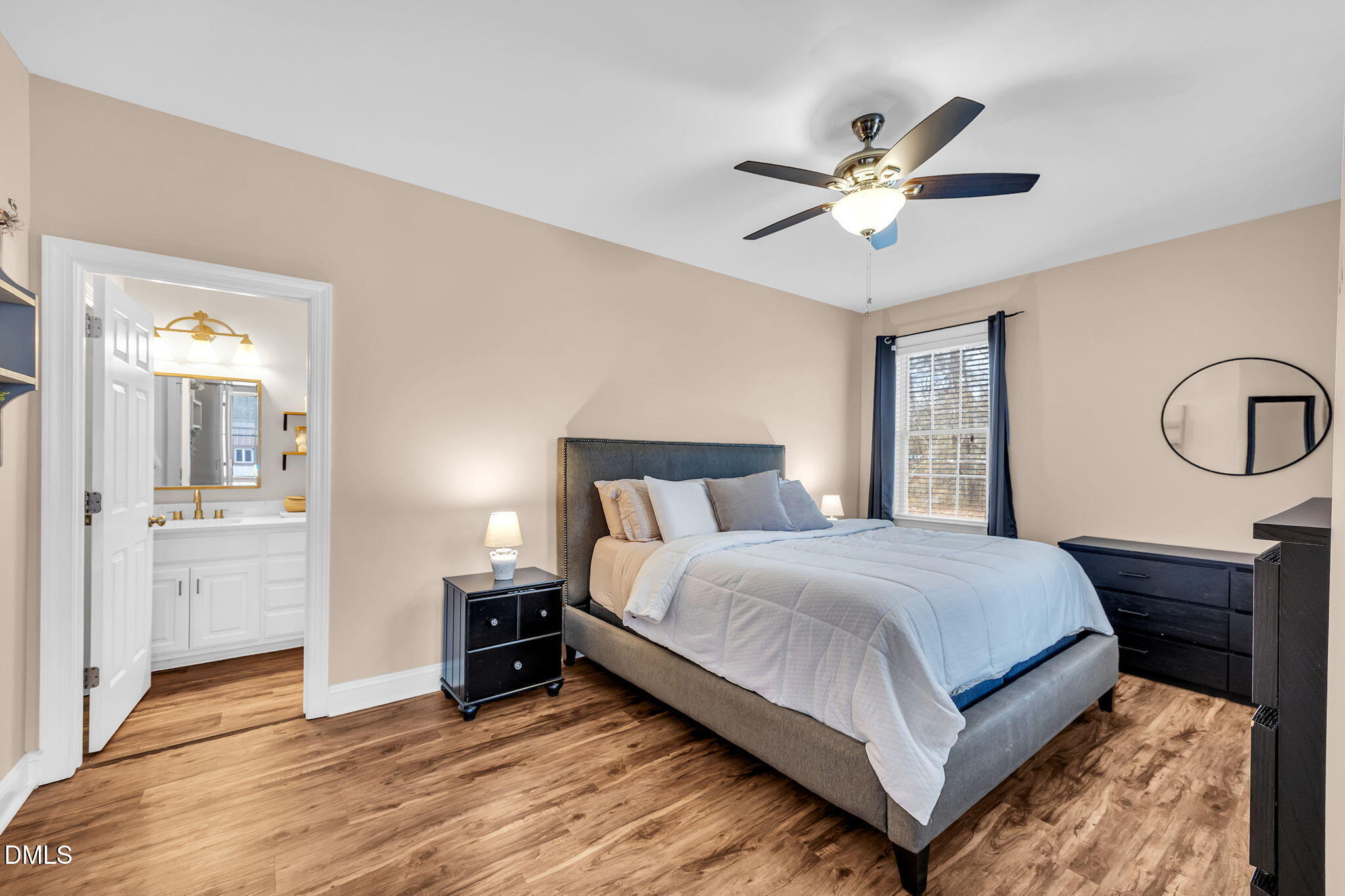 1869 Firetower Road Selma, NC 27576 - Photo 36 of 67 a bedroom with a bed and a chandelier