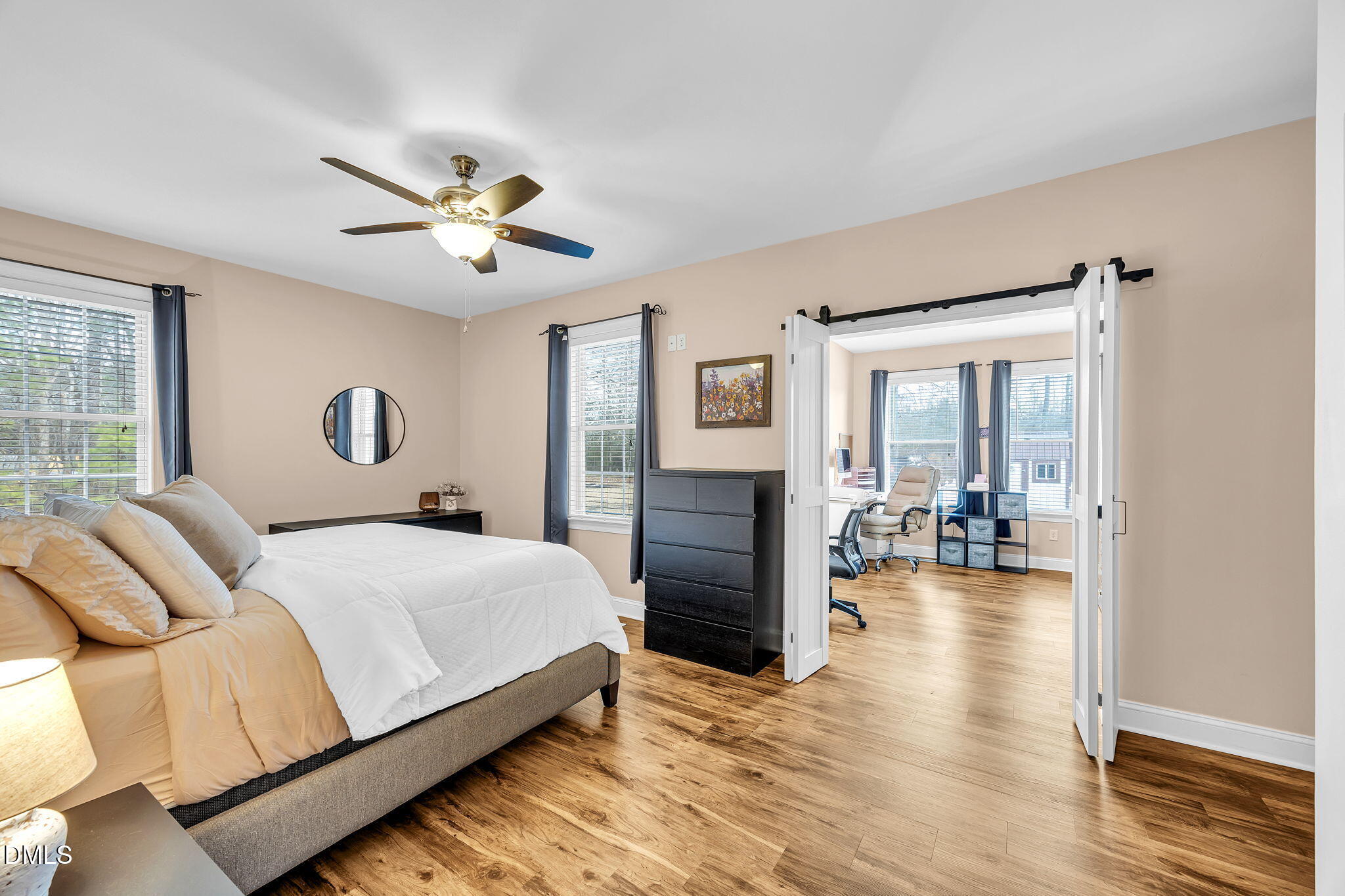 1869 Firetower Road Selma, NC 27576 - Photo 37 of 67 a bedroom with a balcony a bed and a chandelier