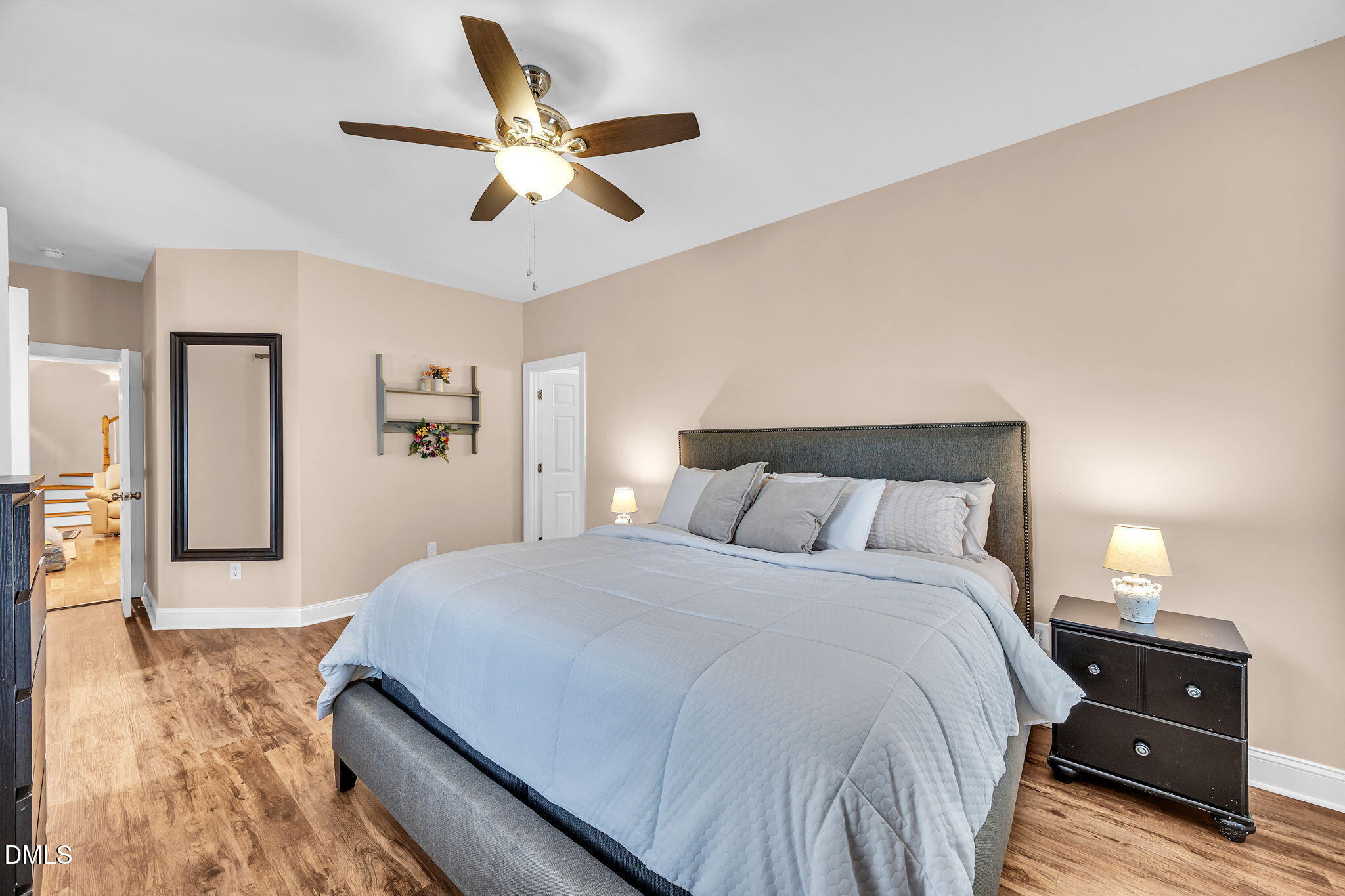 1869 Firetower Road Selma, NC 27576 - Photo 38 of 67 a bedroom with a bed and wooden floor