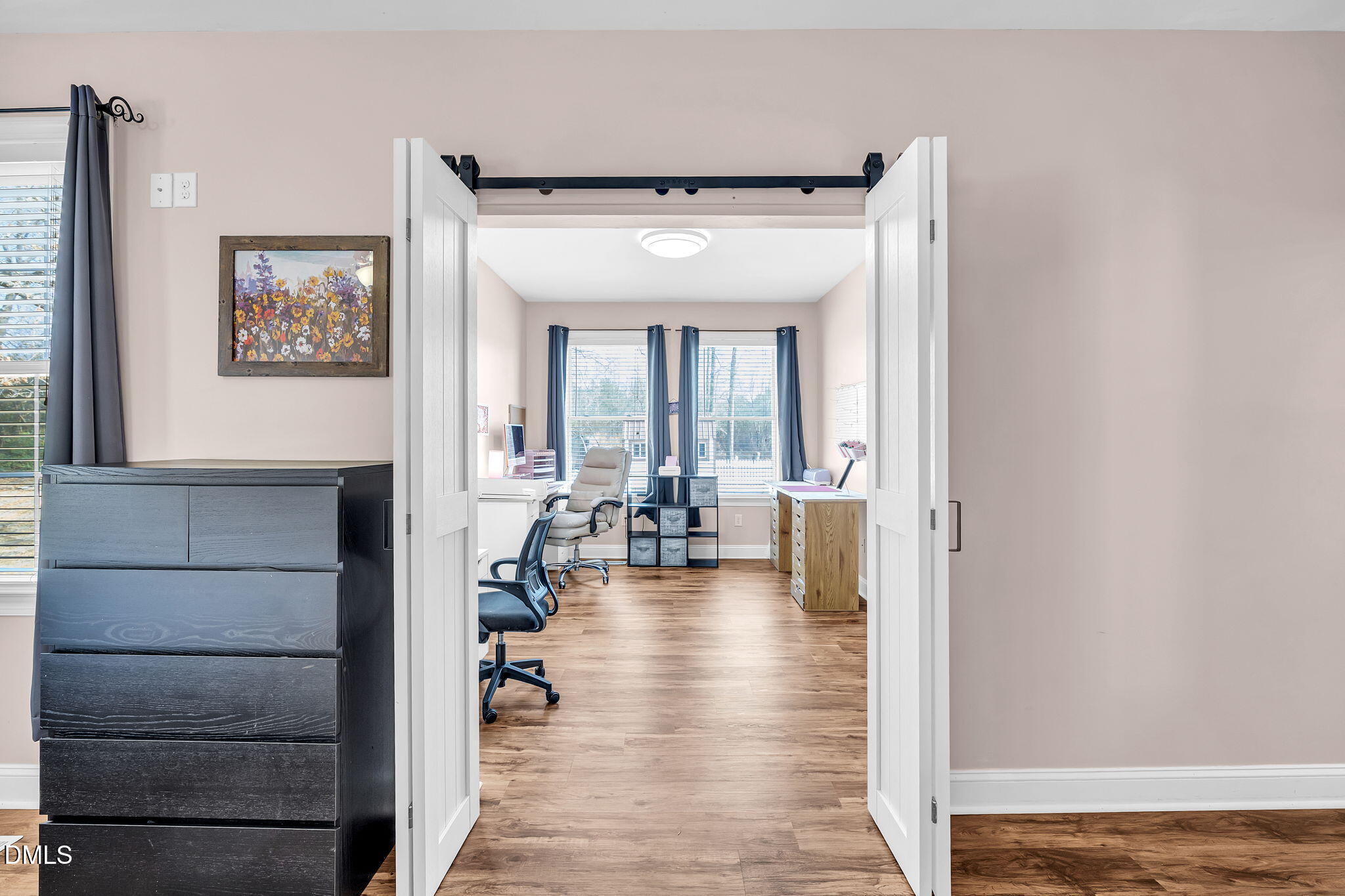1869 Firetower Road Selma, NC 27576 - Photo 40 of 67 a view of a hallway with wooden floor and dining room
