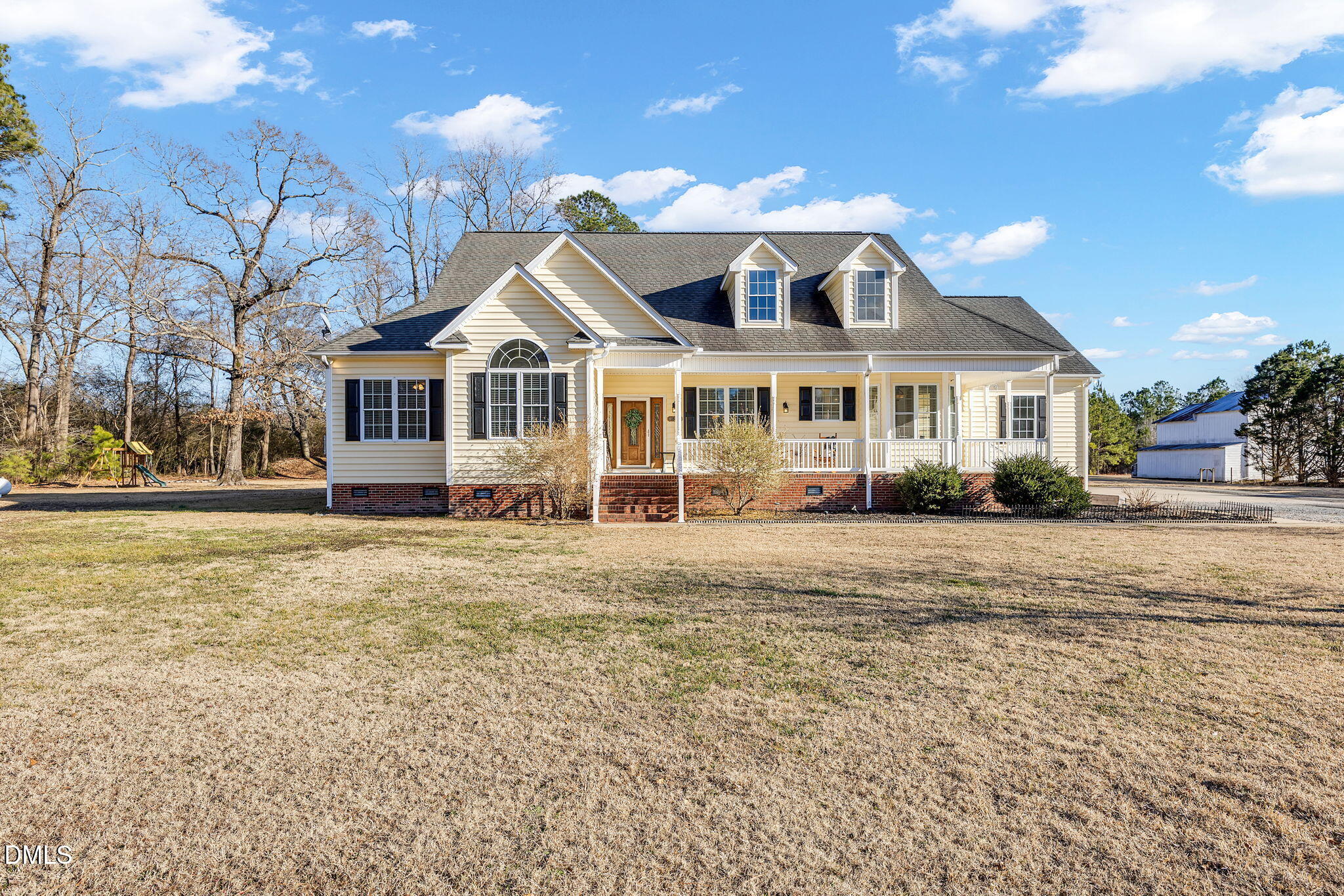 1869 Firetower Road Selma, NC 27576 - Photo 3 of 67 a front view of a house with a garden