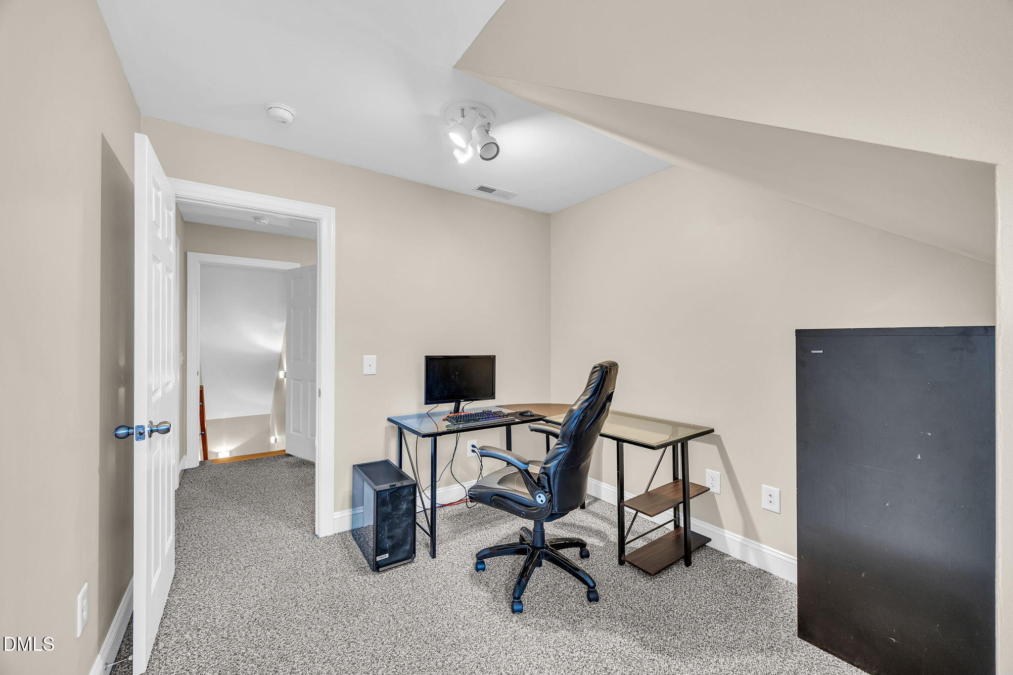 1869 Firetower Road Selma, NC 27576 - Photo 52 of 67 a view of a workspace with furniture and a window