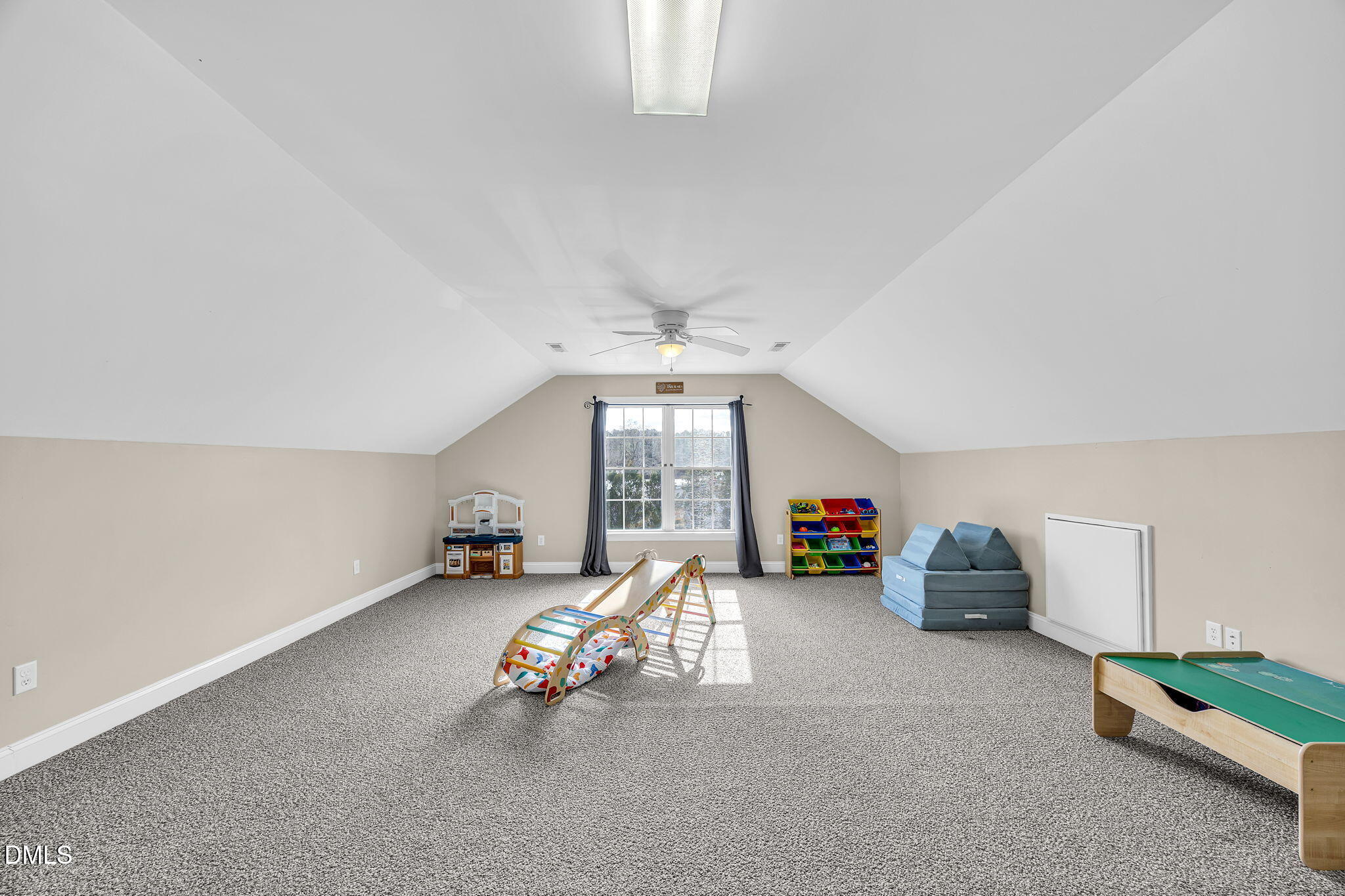 1869 Firetower Road Selma, NC 27576 - Photo 54 of 67 a view of a livingroom with lounge chair and a ceiling fan