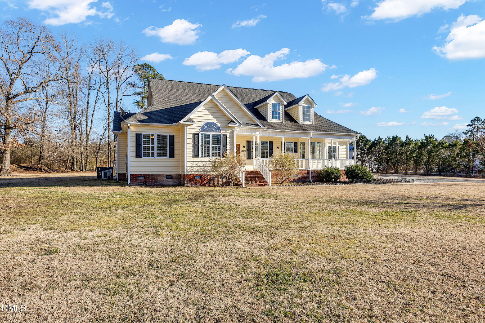 1869 Firetower Road Selma, NC 27576 - Photo 4 of 67 a front view of a house with a yard