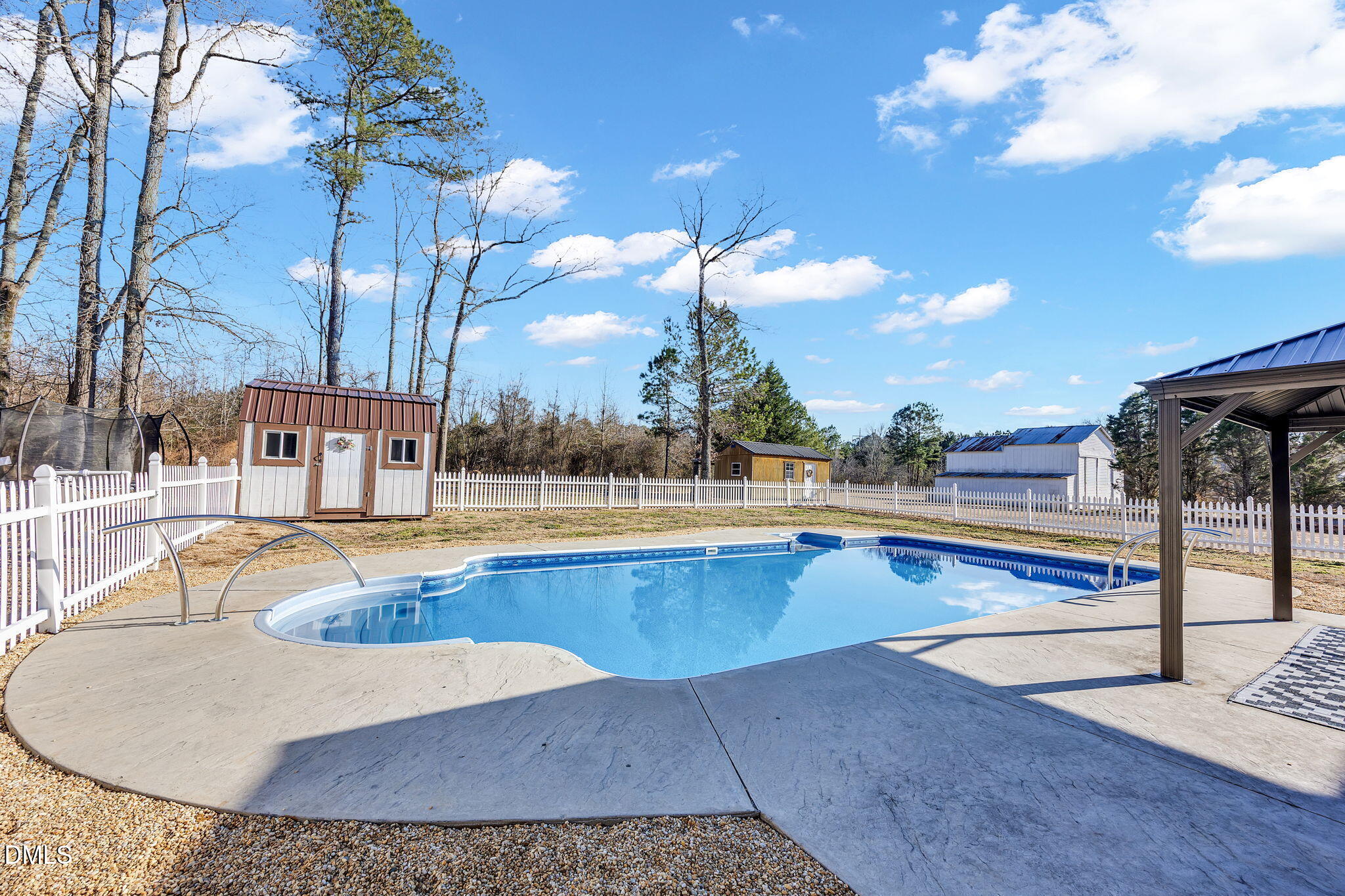 1869 Firetower Road Selma, NC 27576 - Photo 7 of 67 a view of a swimming pool with outdoor seating