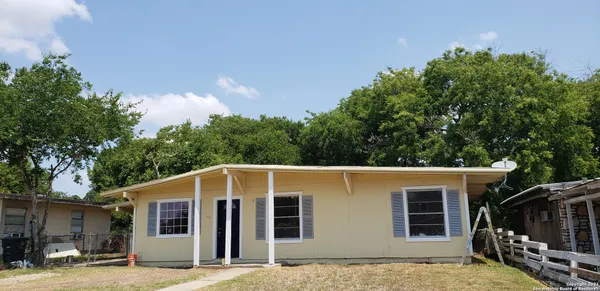 a front view of a house with yard