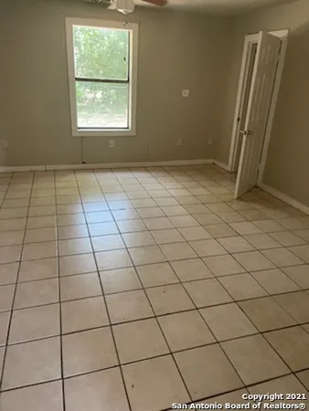 a view of a livingroom and window