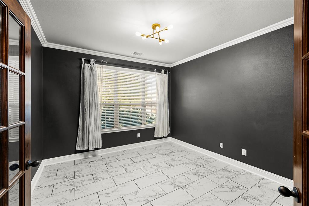 1102 Brigham Drive Forney, TX 75126 - Photo 6 of 30 Spare room with light marble finish floors, crown molding, a chandelier, and french doors