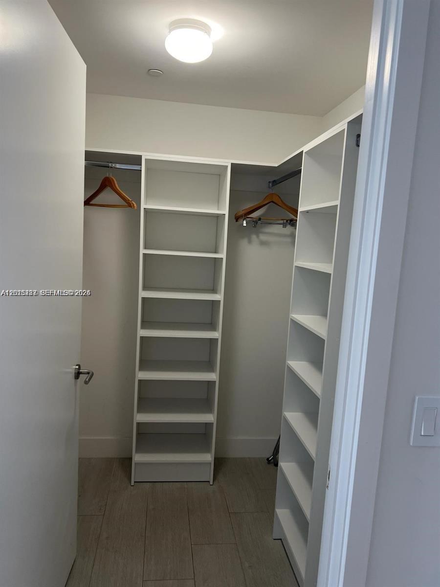 4010 South Ocean Drive, Unit R2004 Hollywood, FL 33019 - Photo 23 of 28 a view of walk in closet with empty racks