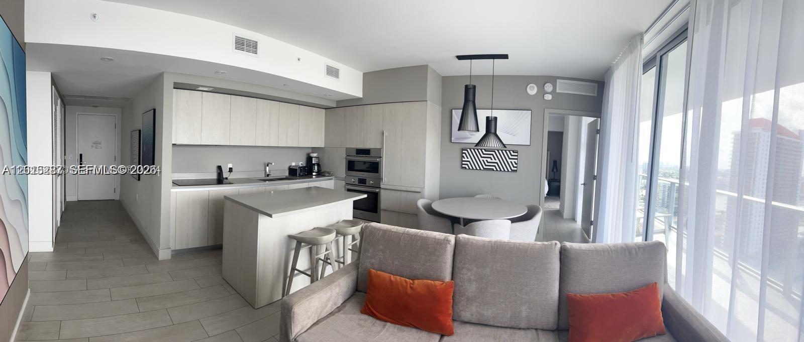4010 South Ocean Drive, Unit R2004 Hollywood, FL 33019 - Photo 27 of 28 a living room with furniture and a window