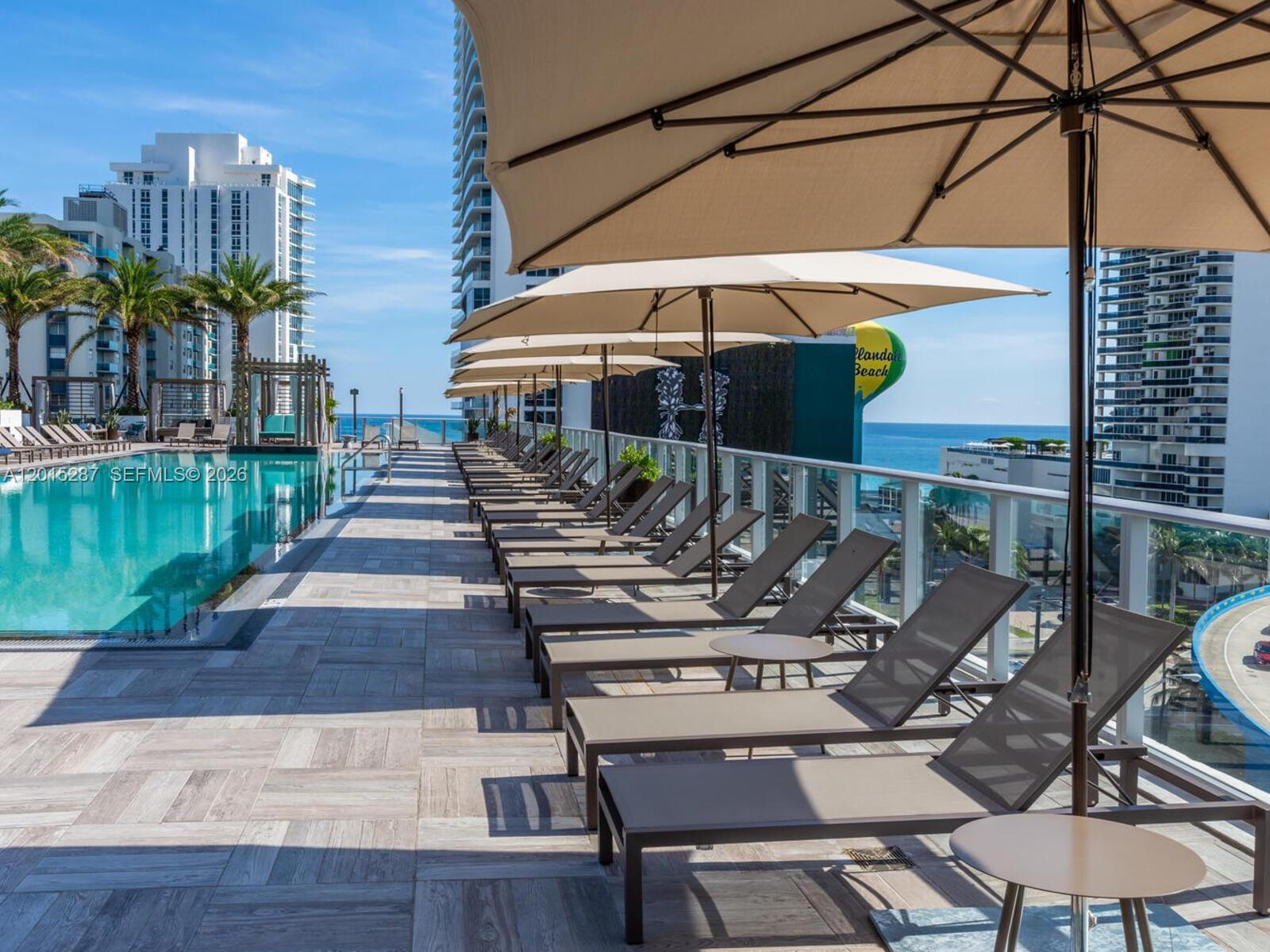 4010 South Ocean Drive, Unit R2004 Hollywood, FL 33019 - Photo 6 of 28 a view of a chairs and table in the patio