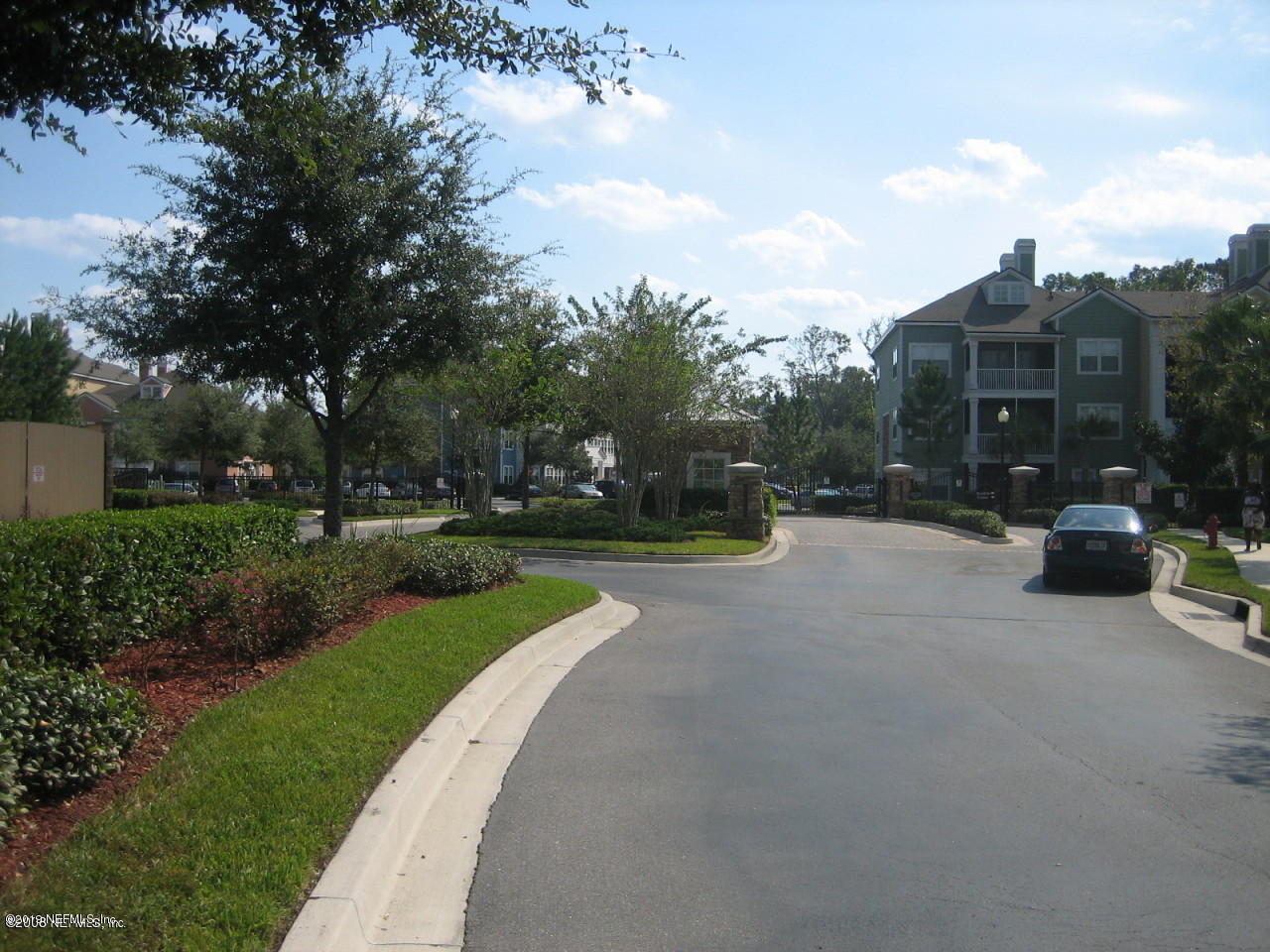 8550 Touchton Road, Unit 323 Jacksonville, FL 32216 - Photo 13 of 19 a view of street with parked cars