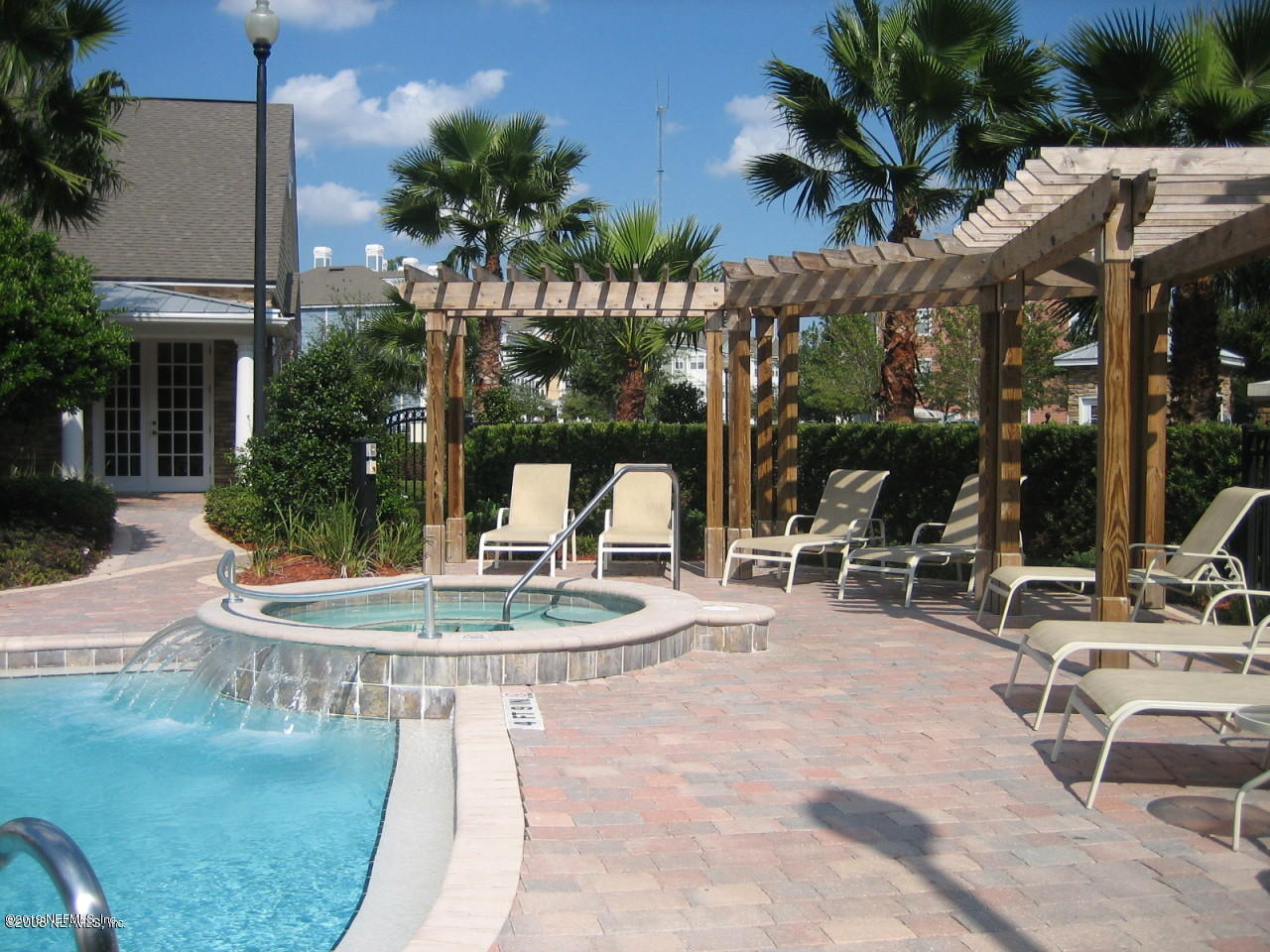8550 Touchton Road, Unit 323 Jacksonville, FL 32216 - Photo 18 of 19 a backyard of a house with outdoor seating