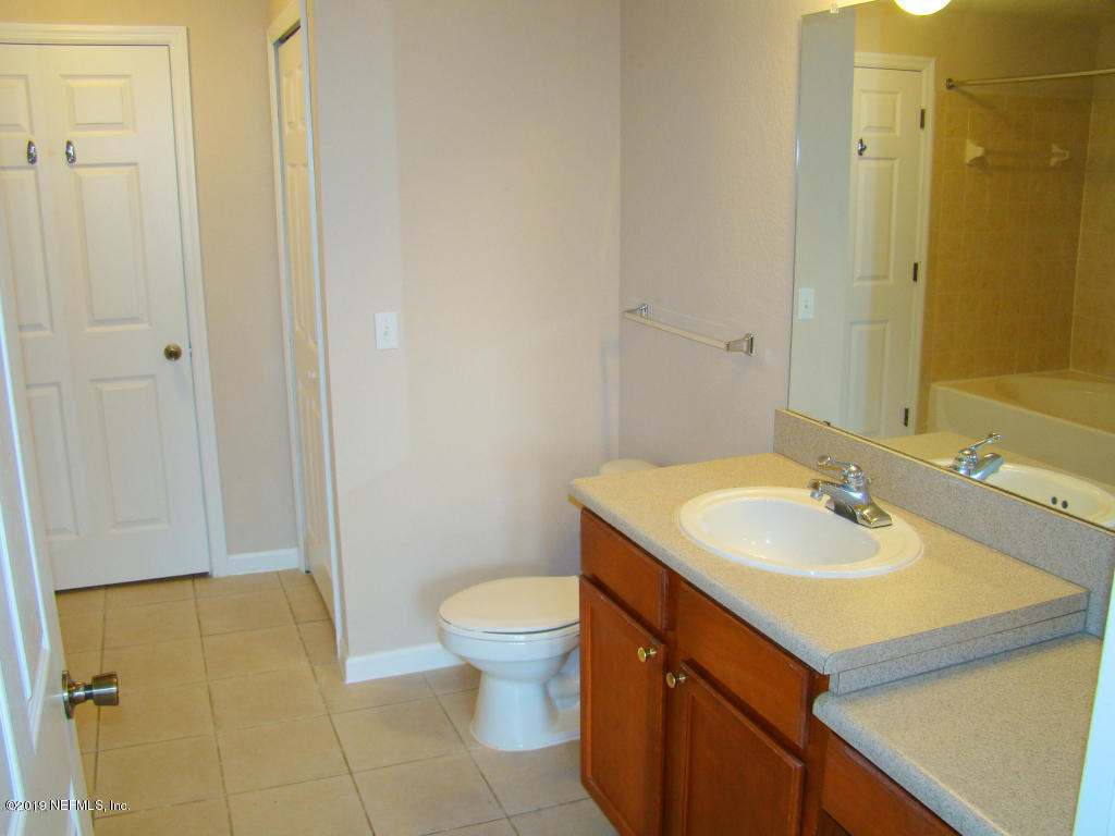 8550 Touchton Road, Unit 323 Jacksonville, FL 32216 - Photo 10 of 19 a bathroom with a sink and a toilet